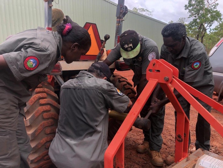 Rangers hard at work on a tractor