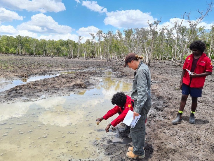 Clarence and Rodney collecting water samples with Ranger Coordinator Helen Truscott.