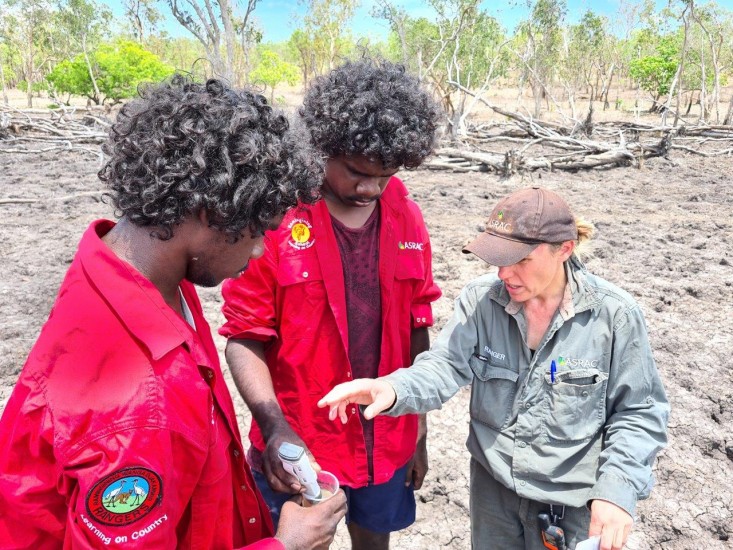 Clarence and Rodney testing water samples with Helen.